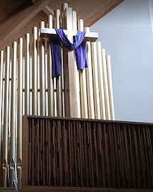 large wooden cross inside church