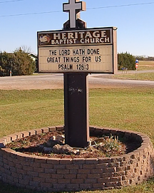 Outdoor sign that reads Heritage Baptist Church