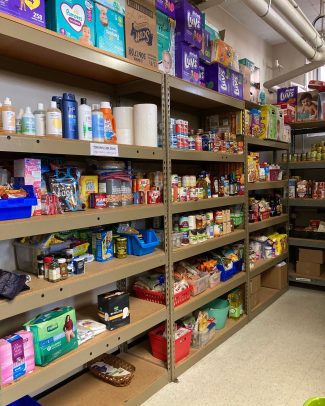 food pantry with shelves stocked with canned items